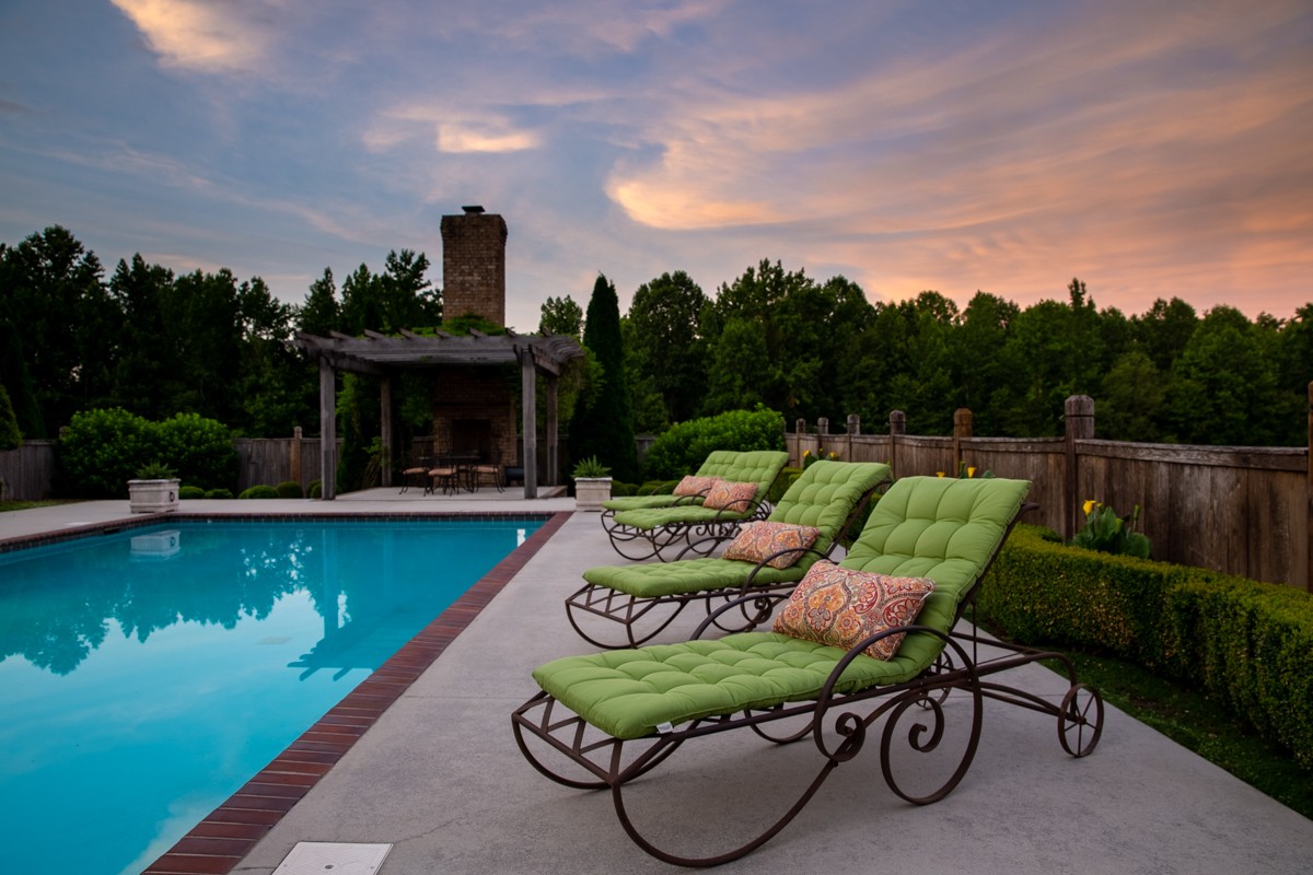 7195 Barker Road Athens, AL 35614 - Photo 22 of 49 a view of a swimming pool with lounge chairs in patio