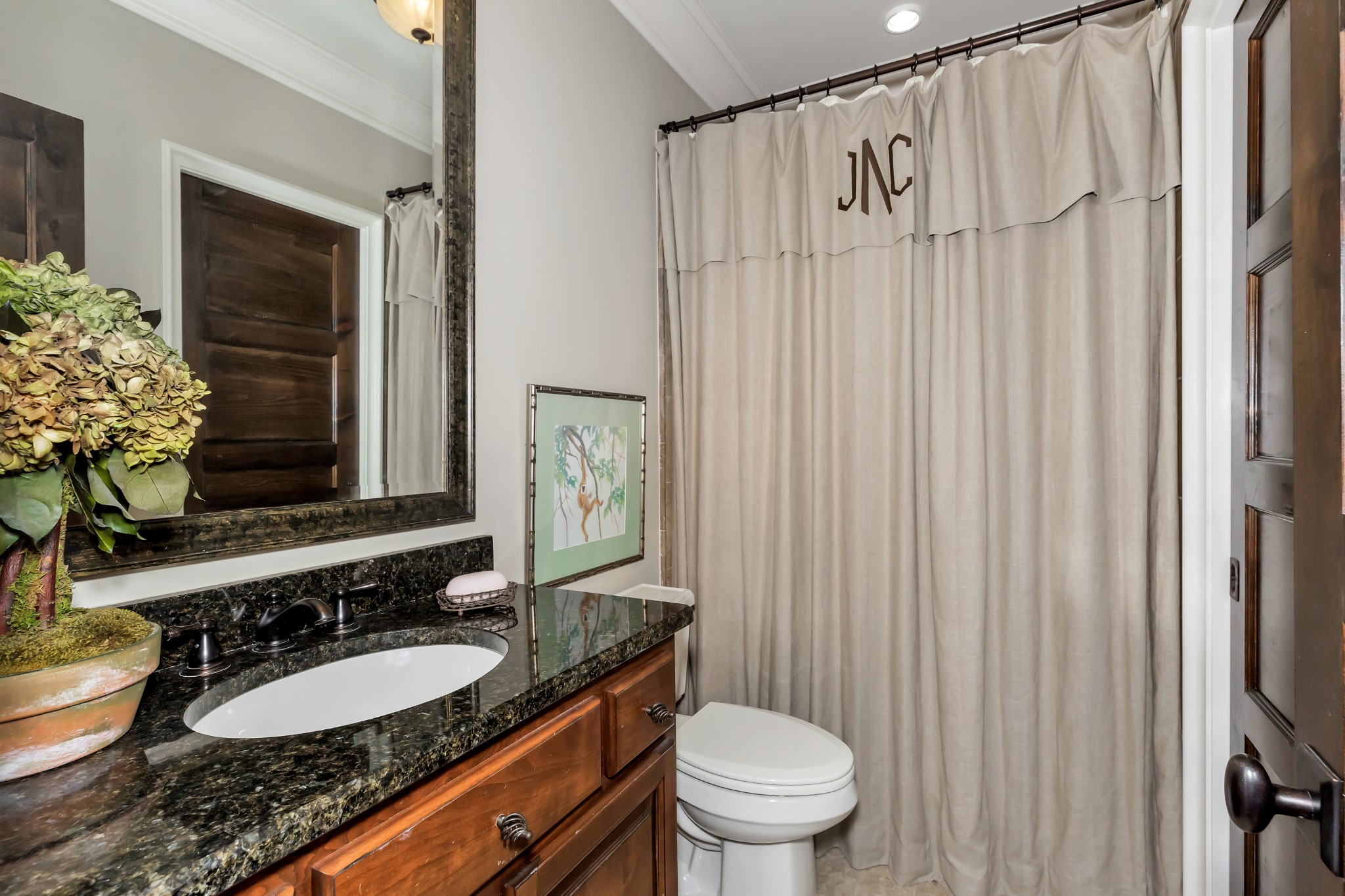 7195 Barker Road Athens, AL 35614 - Photo 42 of 49 a bathroom with a granite countertop sink and a mirror with toilet