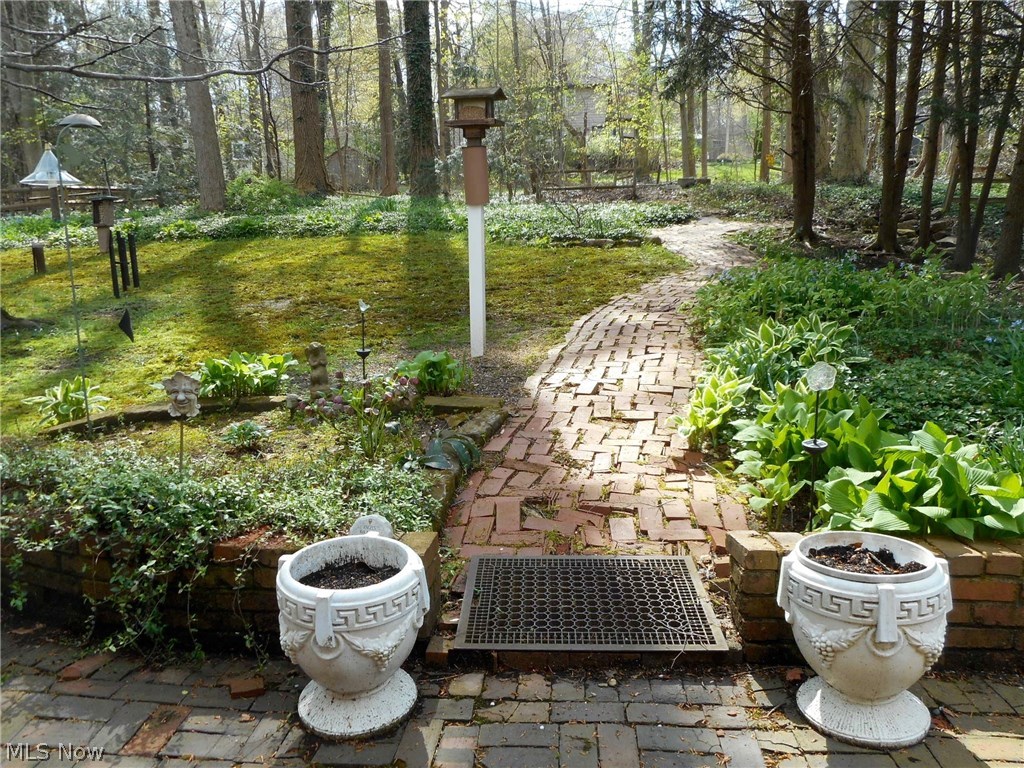 856 Old Spring Road Akron, OH 44321 - Photo 23 of 30 Brick walk way into the wooded backyard.