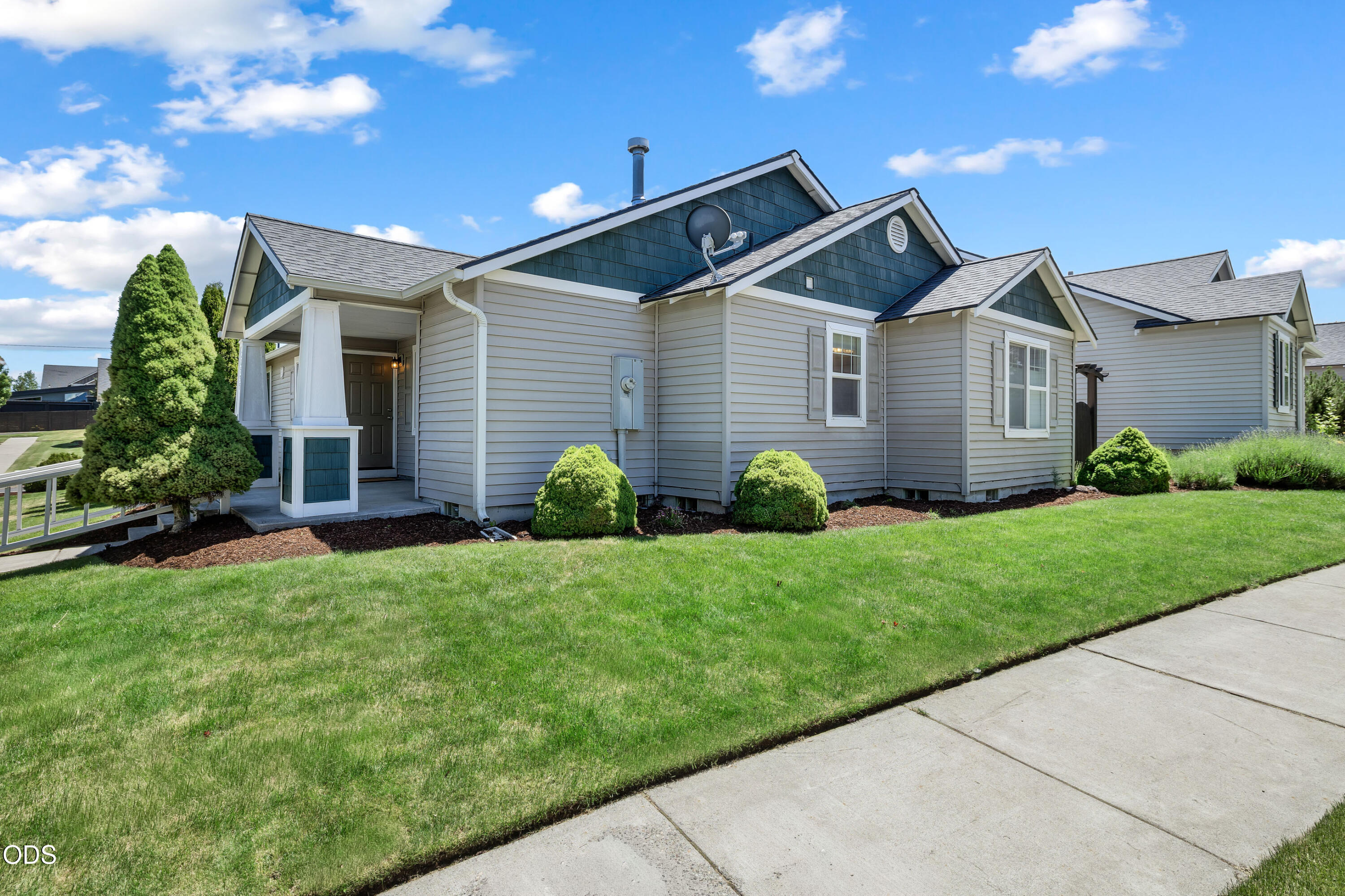 20535 Sunderland Way Bend, OR 97701 - Photo 2 of 41 a front view of a house with garden