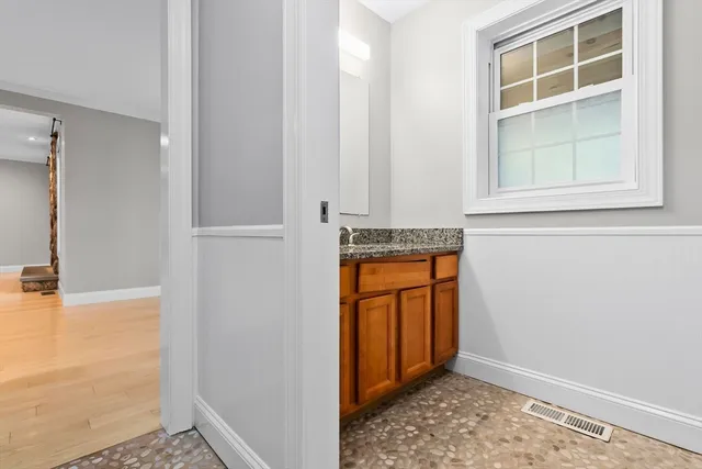 a view of walk in closet with empty room