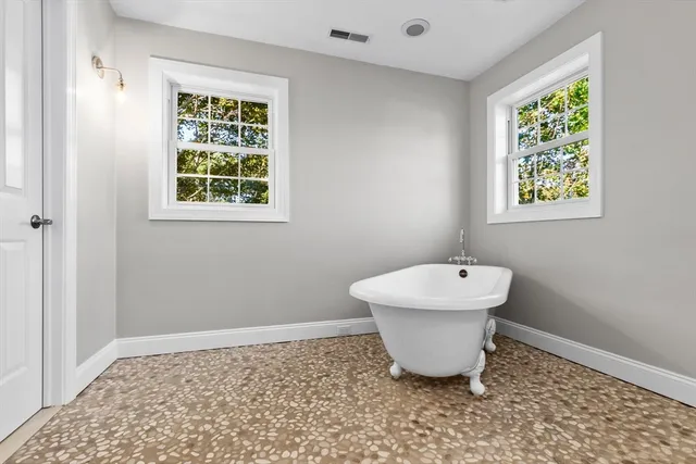 a bathroom with a sink and a window