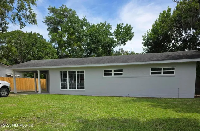 front view of a house with a yard