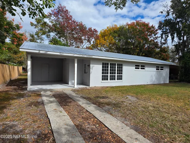 front view of a house with a yard