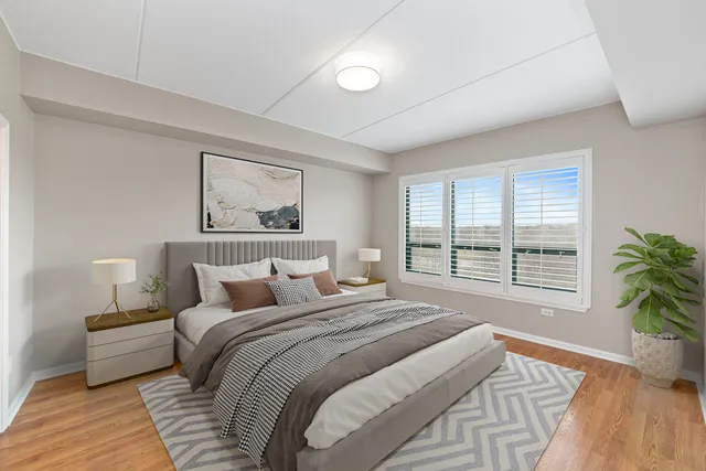 a bedroom with a large bed and a couch