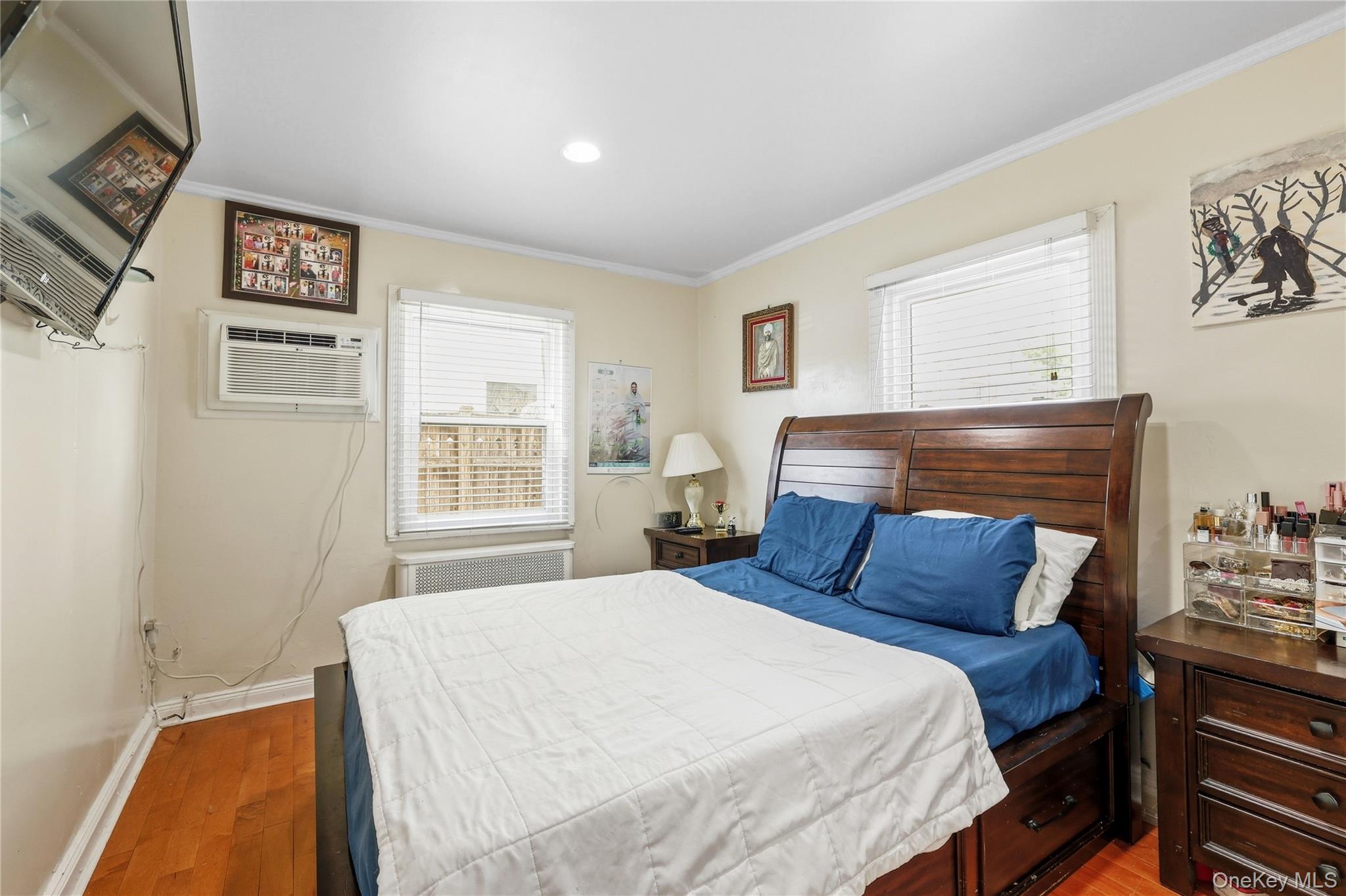 83-39 252nd Street Queens, NY 11426 - Photo 6 of 26 Wood-finish flooring and light-toned walls create a neutral backdrop for the room