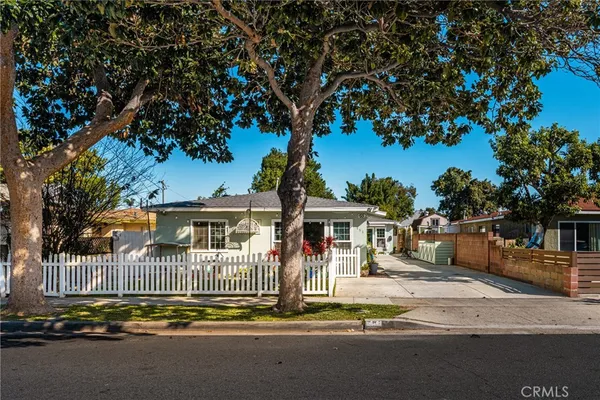 a front view of house and yard with seating space