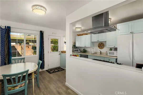 a kitchen with a sink and a stove top oven