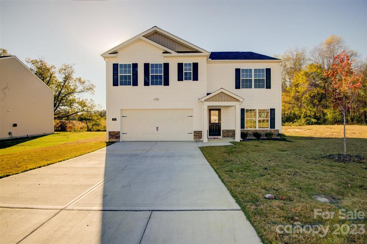 220 Jackson Way Lexington, NC 27295 - Photo 1 of 33 a front view of a house with a yard