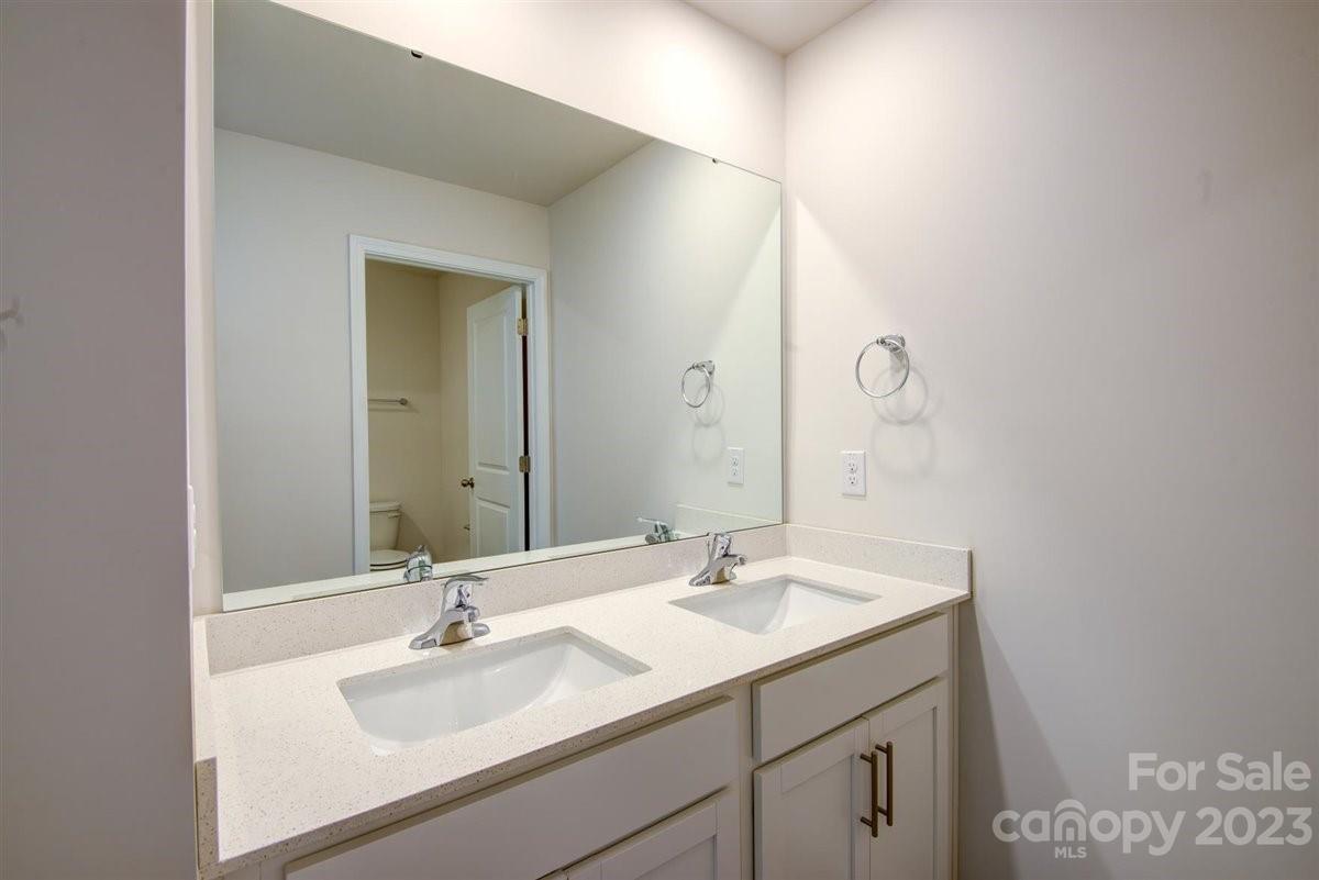 220 Jackson Way Lexington, NC 27295 - Photo 19 of 33 a bathroom with a sink and a mirror