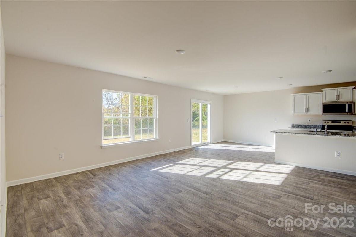 220 Jackson Way Lexington, NC 27295 - Photo 27 of 33 a view of empty room with wooden floor and fan