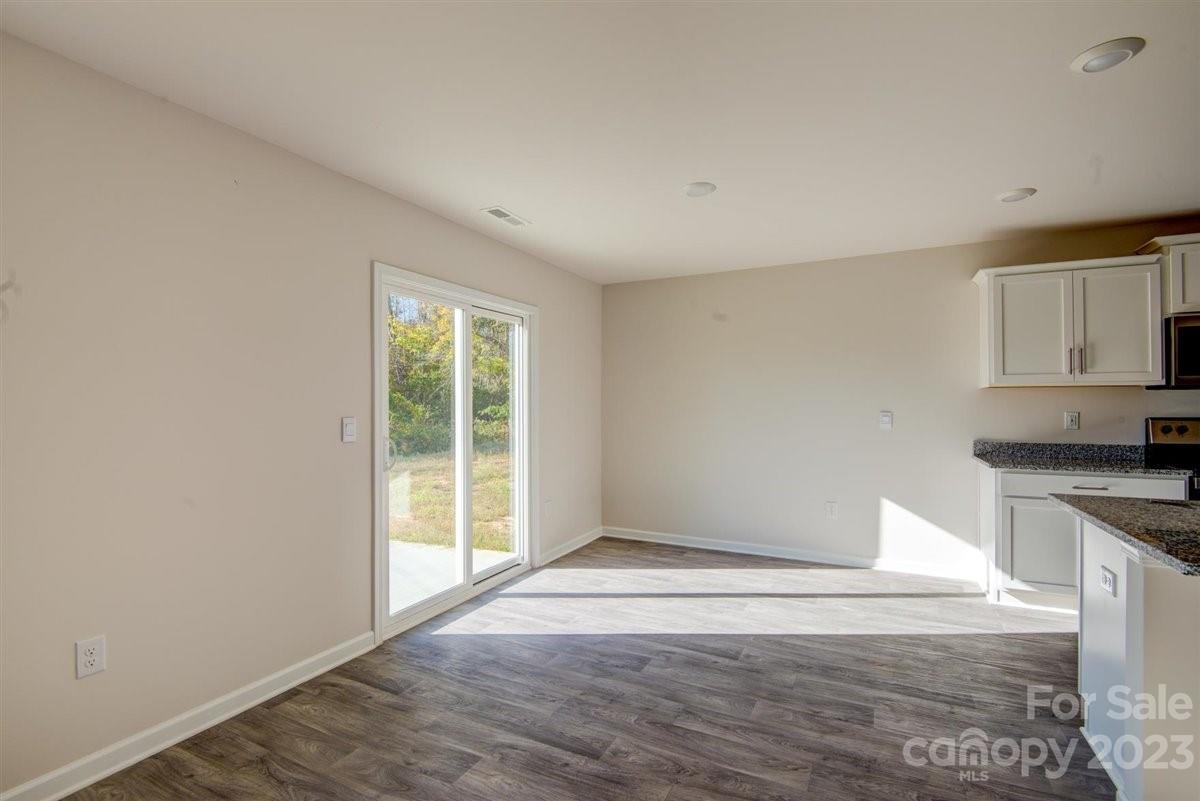 220 Jackson Way Lexington, NC 27295 - Photo 28 of 33 a view of a kitchen with wooden floor and electronic appliances