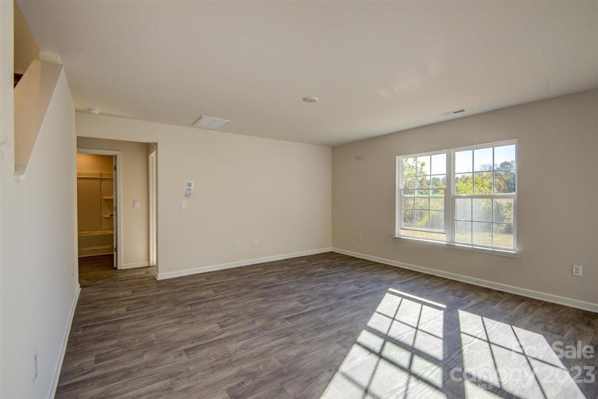 220 Jackson Way Lexington, NC 27295 - Photo 29 of 33 a view of an empty room with wooden floor and a window