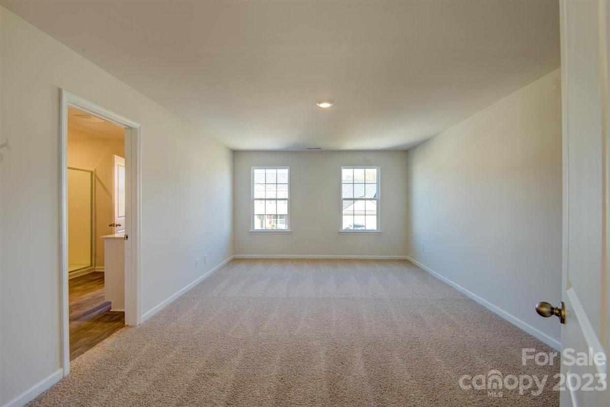 220 Jackson Way Lexington, NC 27295 - Photo 10 of 33 a view of a big room with windows and chandelier fan
