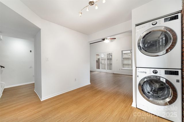 a view of a hallway with washer and dryer
