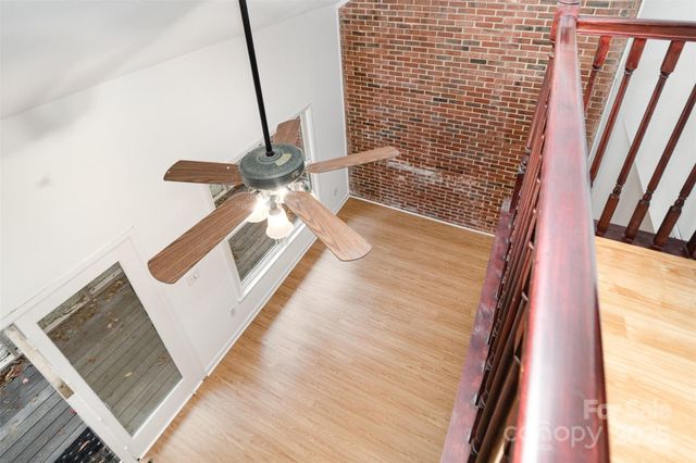 a view of living room with furniture and a gate