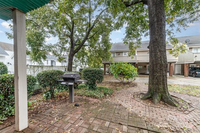a view of a chairs in a backyard