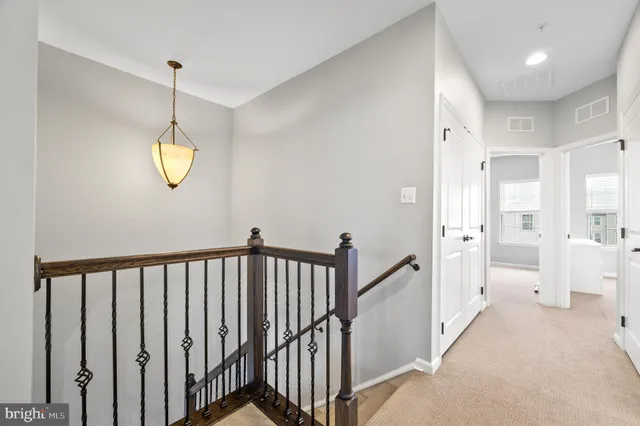 a spacious bedroom with a bed and ceiling fan