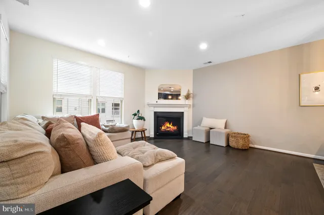 a view of a dining room with furniture wooden floor and a chandelier