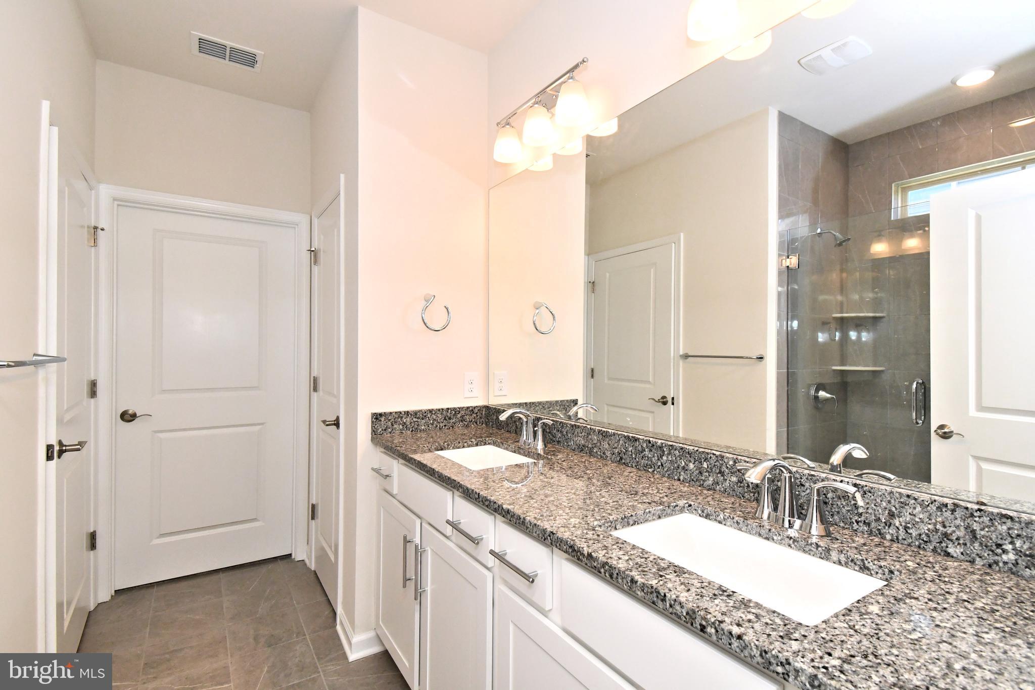 1024 Wright Street Hatfield, PA 19440 - Photo 20 of 68 a bathroom with a granite countertop sink and a mirror
