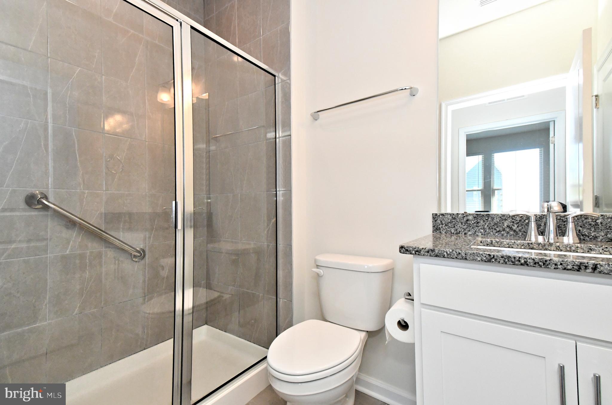 1024 Wright Street Hatfield, PA 19440 - Photo 24 of 68 a bathroom with a granite countertop sink toilet and shower