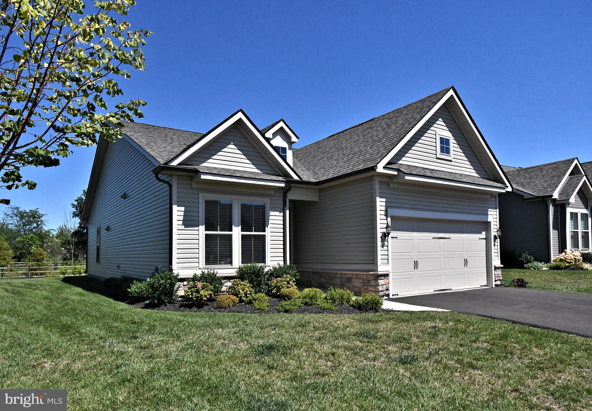 1024 Wright Street Hatfield, PA 19440 - Photo 3 of 68 a front view of a house with a yard and garage