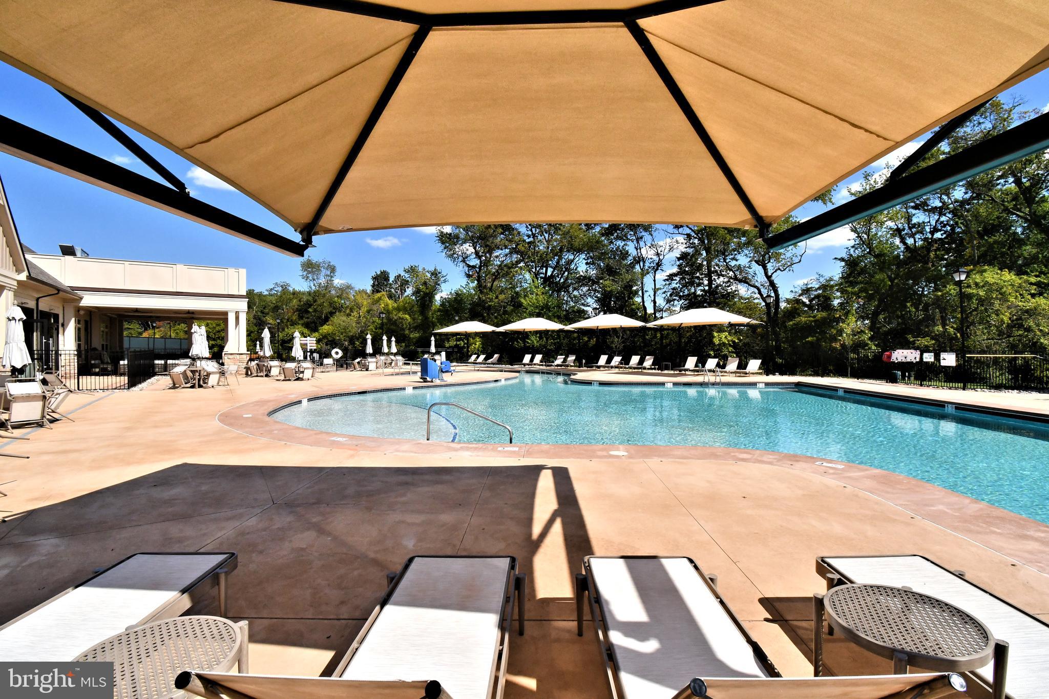 1024 Wright Street Hatfield, PA 19440 - Photo 64 of 68 a view of swimming pool with lawn chairs under an umbrella