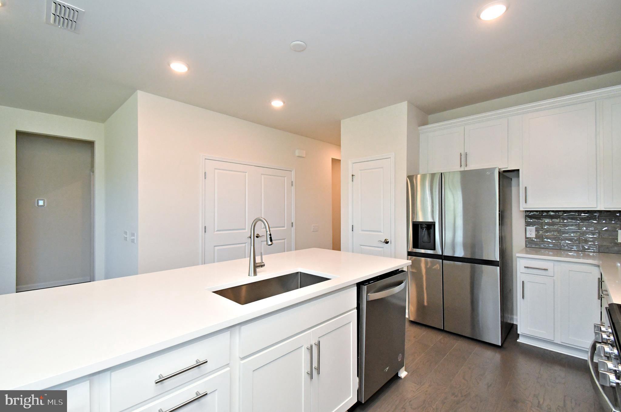 1024 Wright Street Hatfield, PA 19440 - Photo 10 of 68 a kitchen with a sink stainless steel appliances and refrigerator
