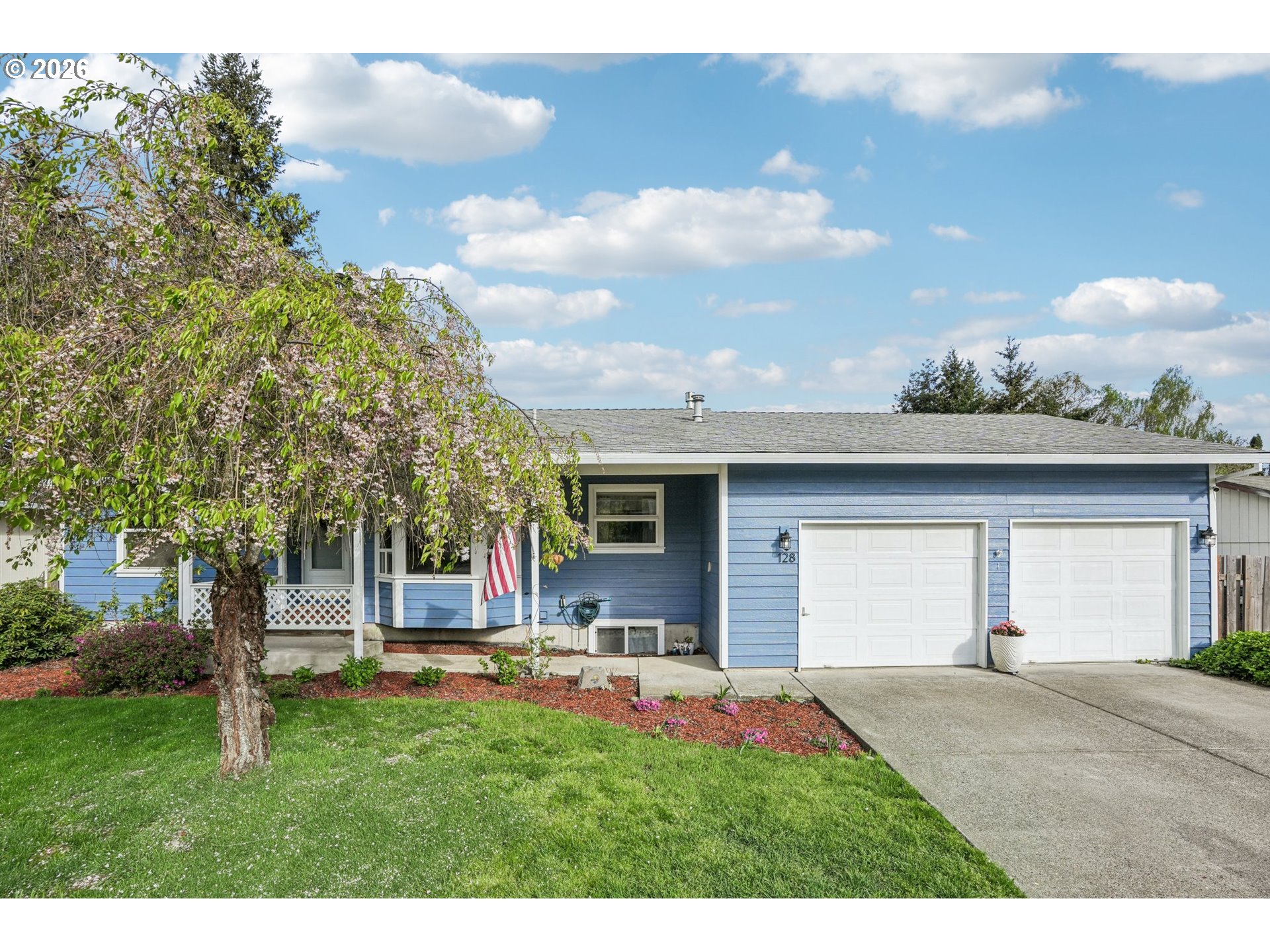 128 North 31st Avenue Cornelius, OR 97113 - Photo 1 of 32 a view of a backyard with a garden and entertaining space