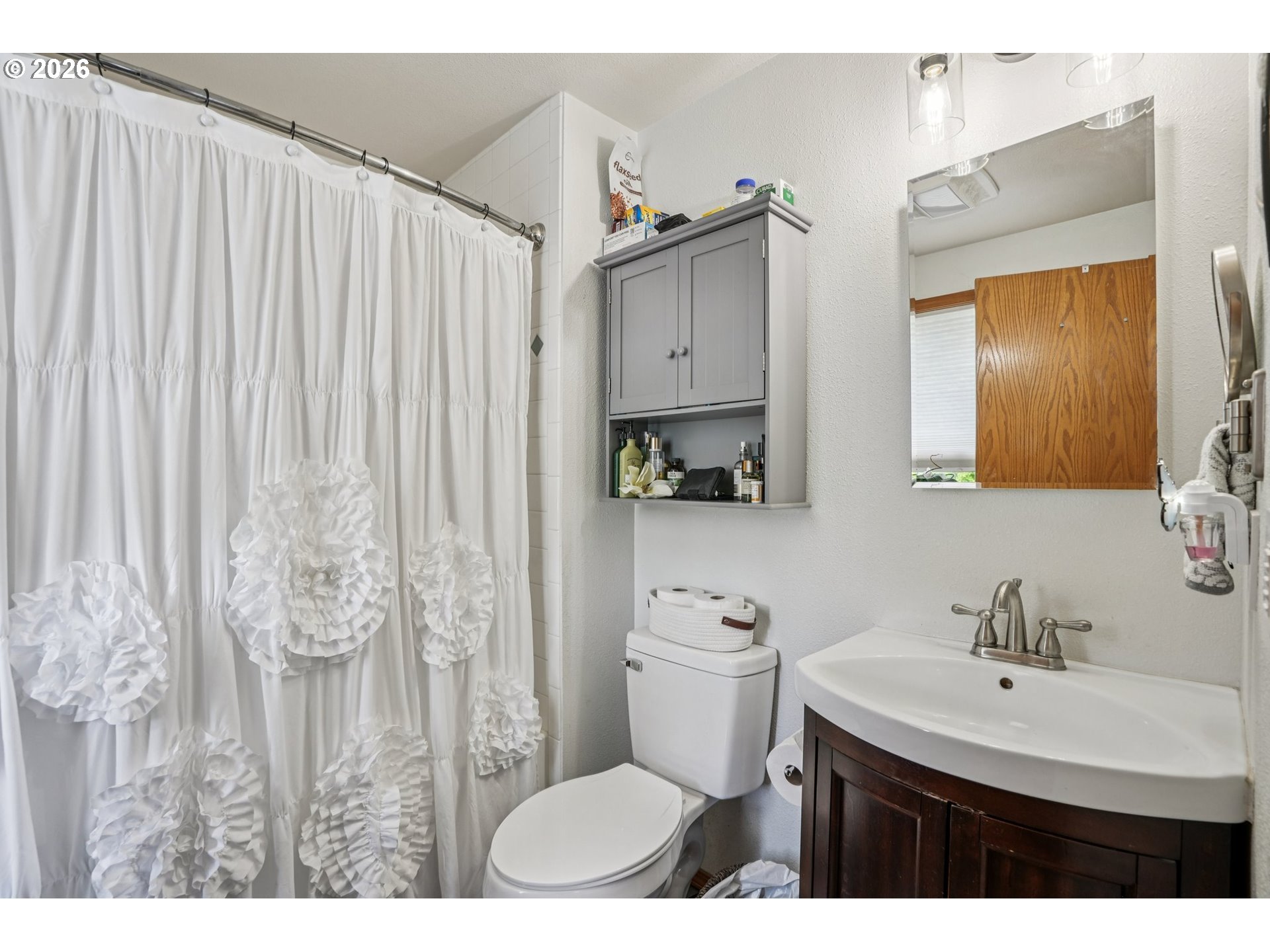 128 North 31st Avenue Cornelius, OR 97113 - Photo 12 of 32 a bathroom with a sink a toilet and a mirror