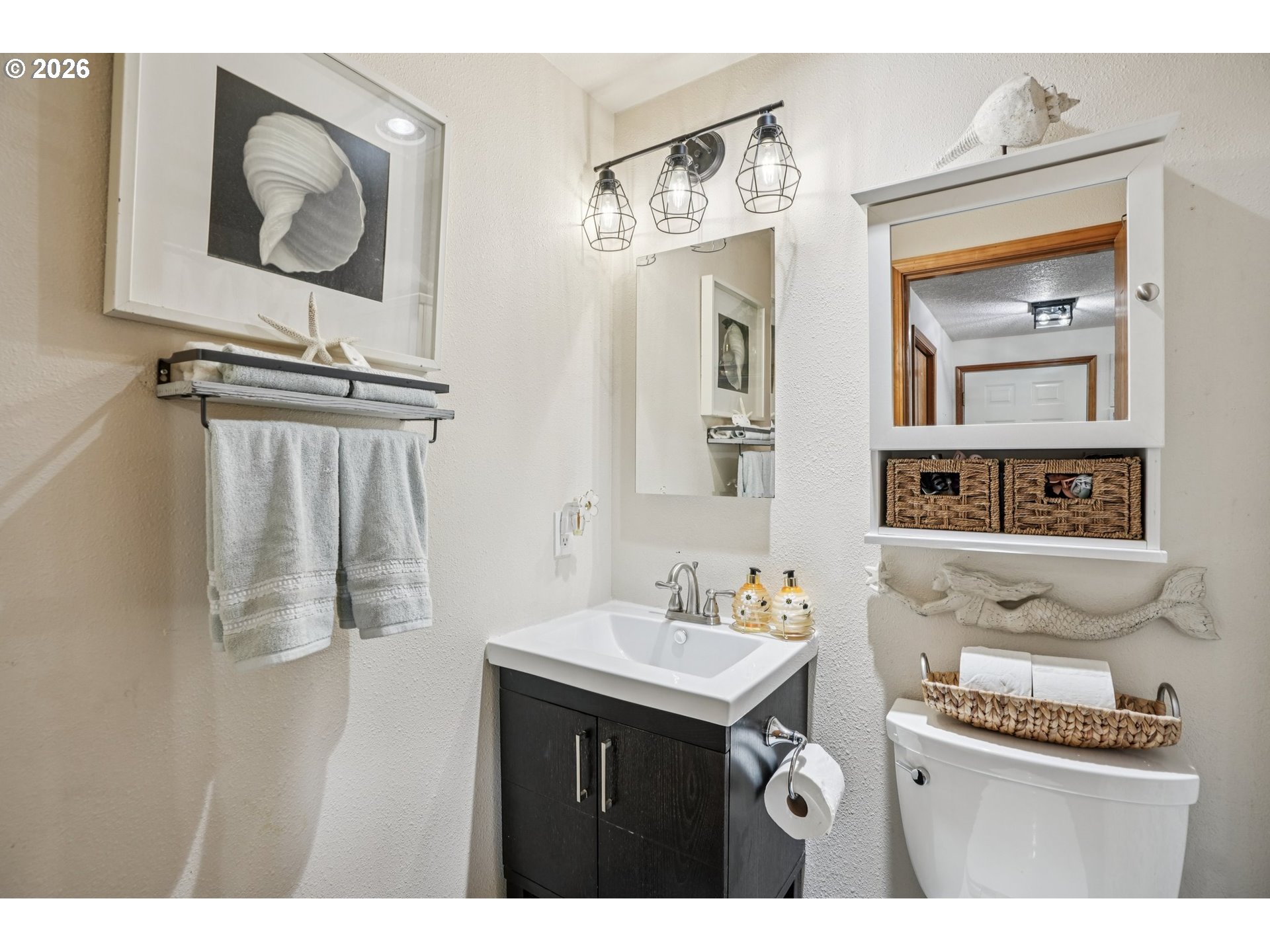 128 North 31st Avenue Cornelius, OR 97113 - Photo 14 of 32 a bathroom with a sink a mirror and a toilet