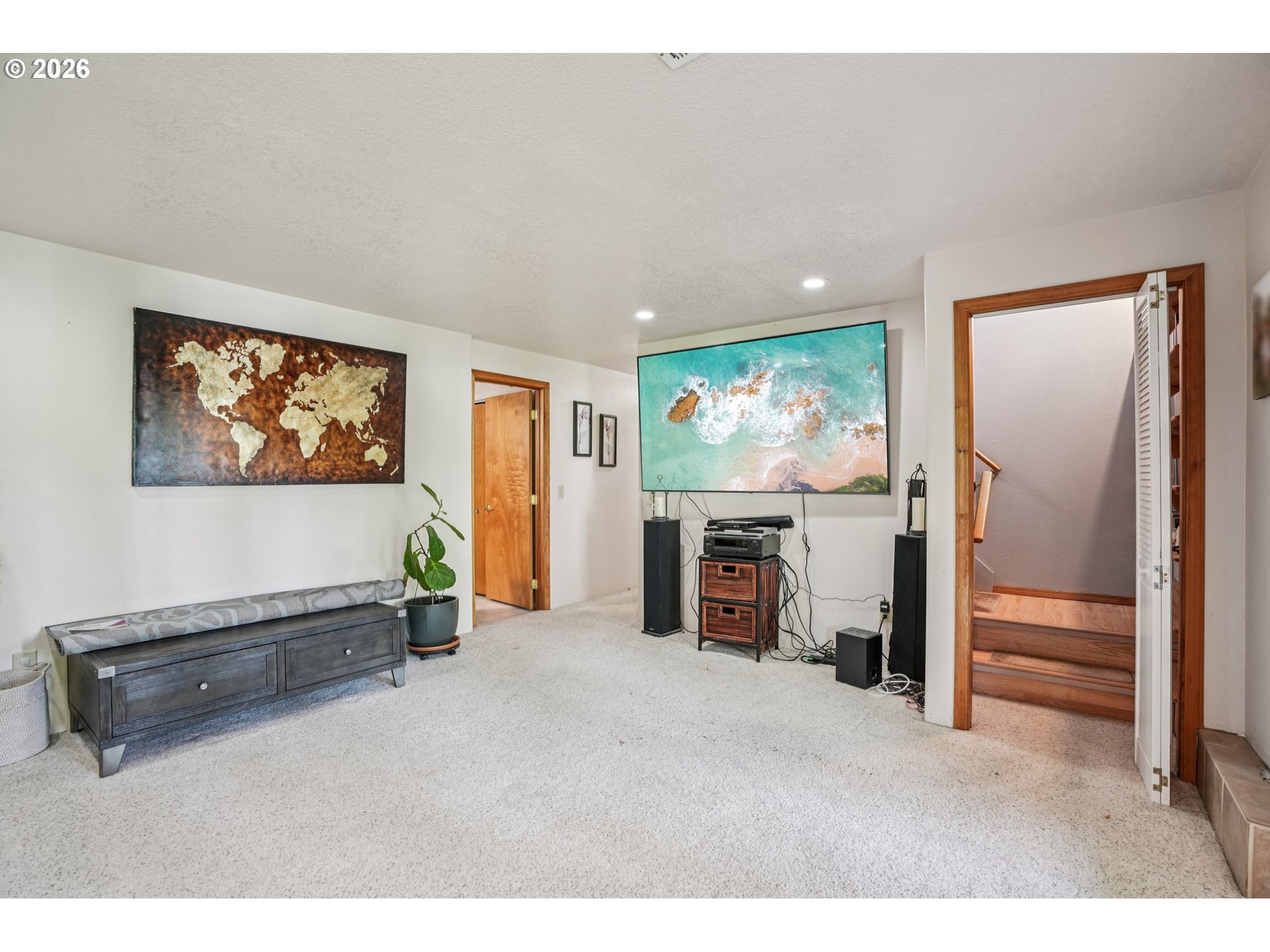 128 North 31st Avenue Cornelius, OR 97113 - Photo 17 of 32 a living room with furniture a flat screen tv and a large window