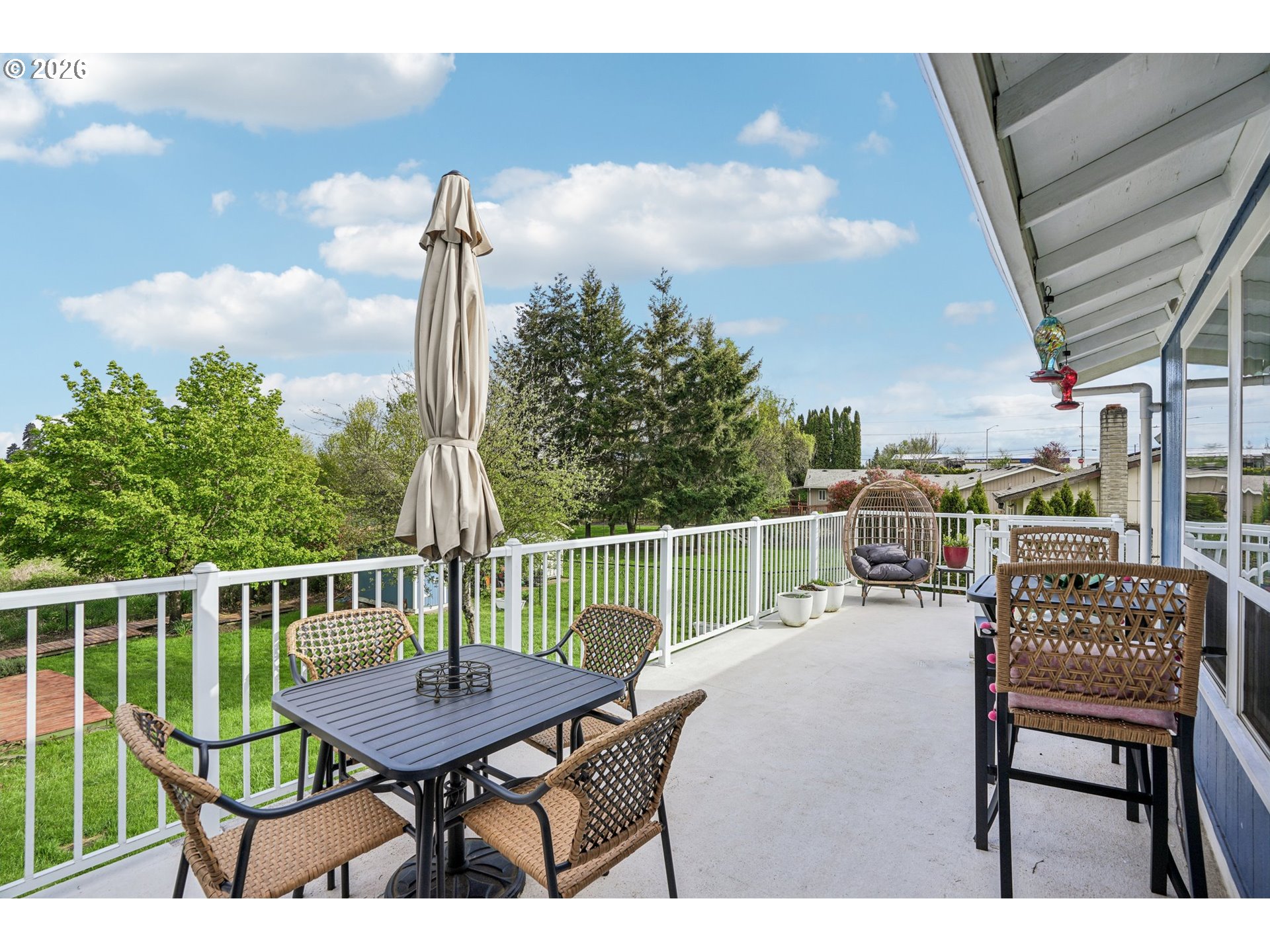128 North 31st Avenue Cornelius, OR 97113 - Photo 23 of 32 a balcony with wooden floor table and chairs