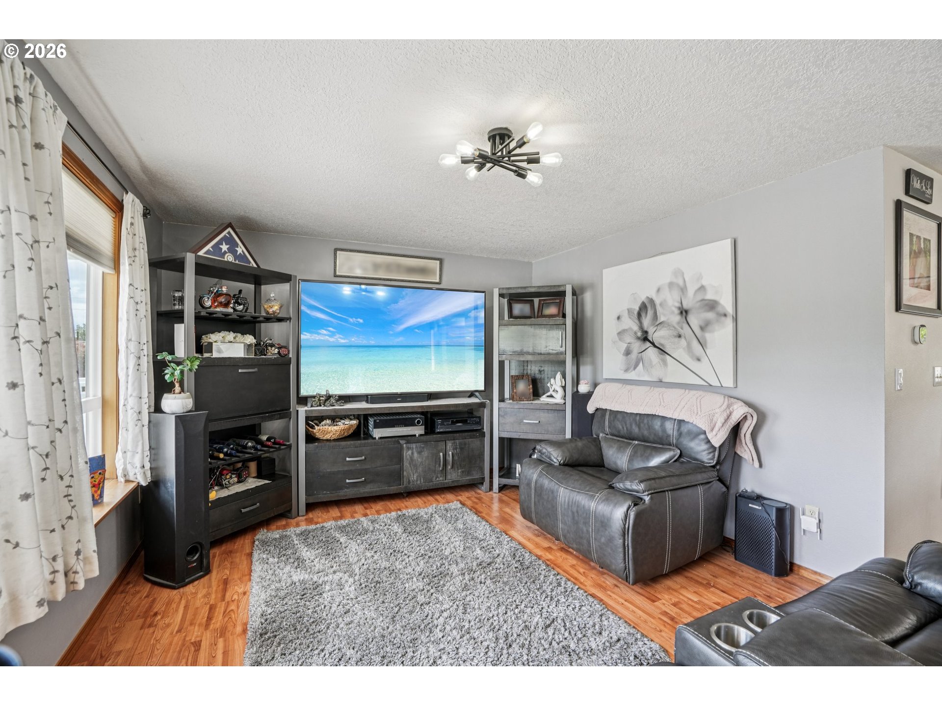 128 North 31st Avenue Cornelius, OR 97113 - Photo 6 of 32 a living room with furniture and a flat screen tv