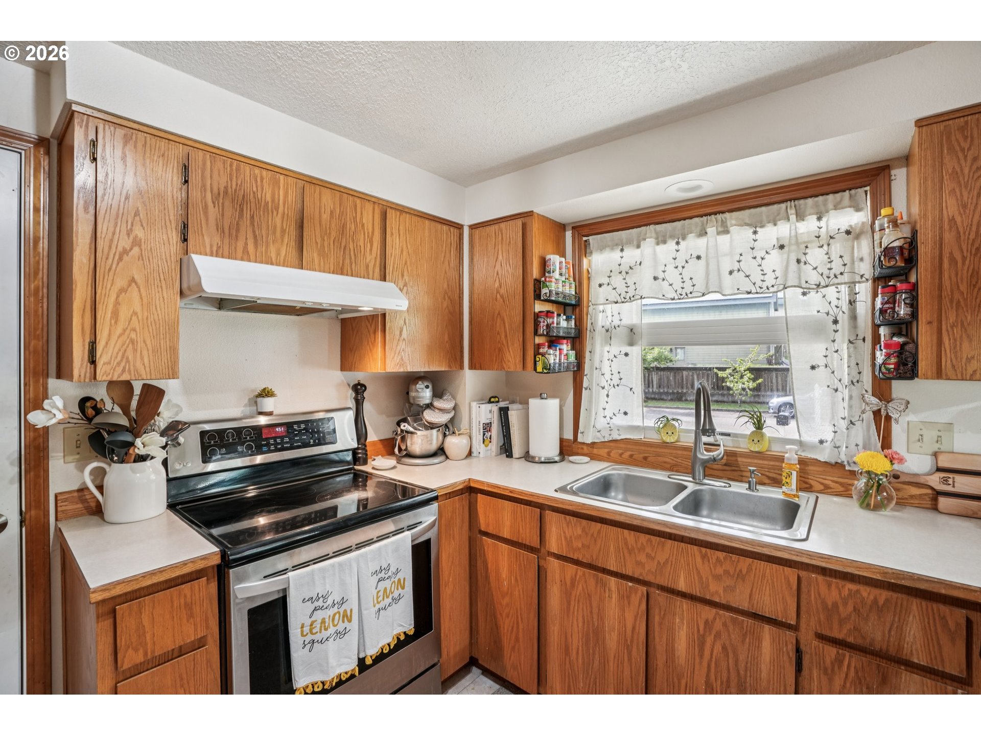 128 North 31st Avenue Cornelius, OR 97113 - Photo 8 of 32 a kitchen with a sink stove and cabinets
