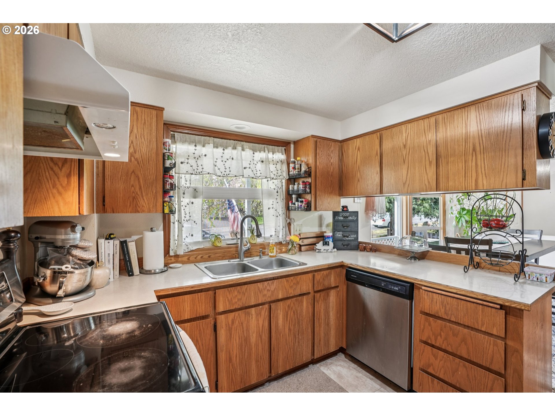 128 North 31st Avenue Cornelius, OR 97113 - Photo 9 of 32 a kitchen with a sink stove and cabinets