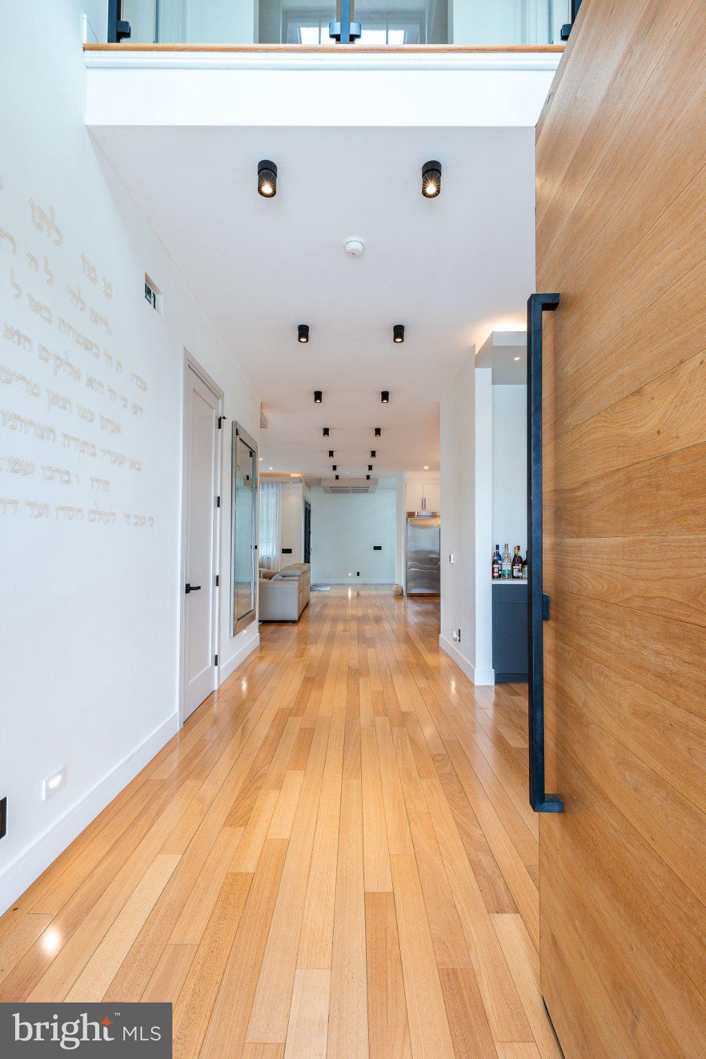9739 Krewstown Road Philadelphia, PA 19115 - Photo 3 of 84 Elegant hallway with warm wood tones.