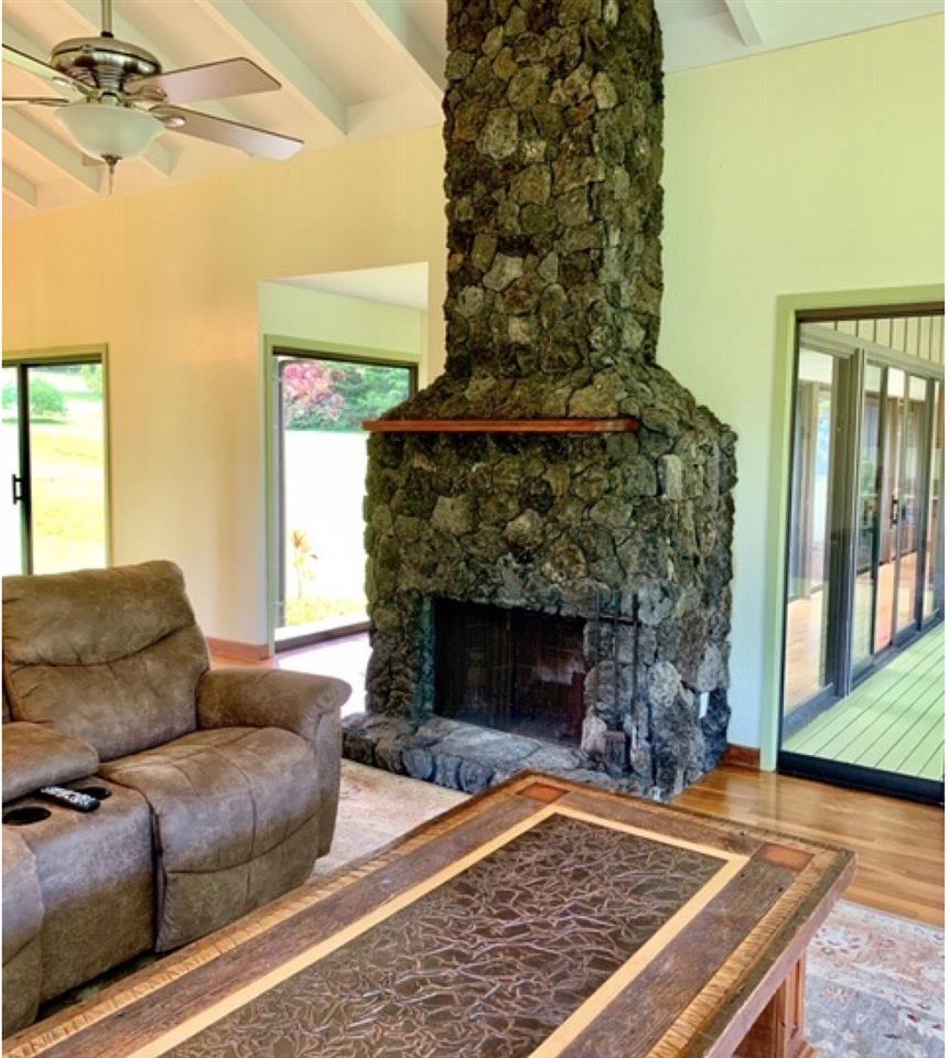 60 Kalo Road Hana, HI 96713 - Photo 12 of 30 a living room with furniture and a fireplace