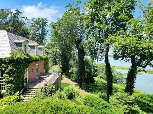 an aerial view of a house with yard and outdoor seating