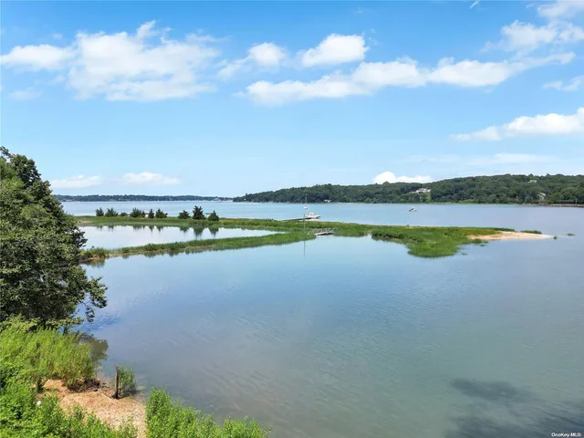 a view of an ocean and city