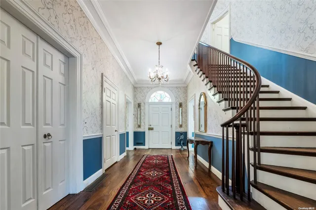 a view of entryway with wooden floor