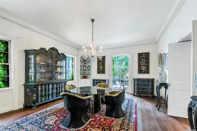a living room with furniture a window and a table