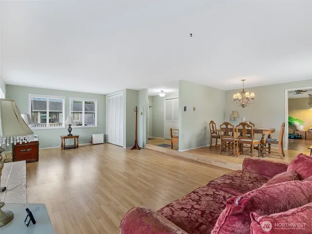 a view of a dining room with furniture window and wooden floor
