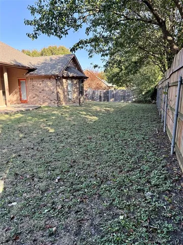 a backyard of a house with lots of green space