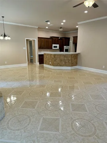 a view of a kitchen with a sink and an oven