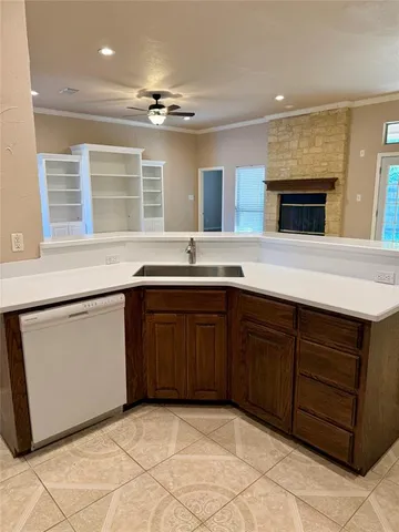 a kitchen with a sink and cabinets