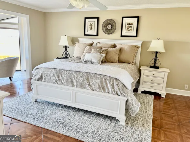 a bed sitting in a bedroom next to a window