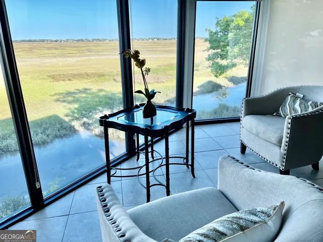 a view of a living room with furniture and window