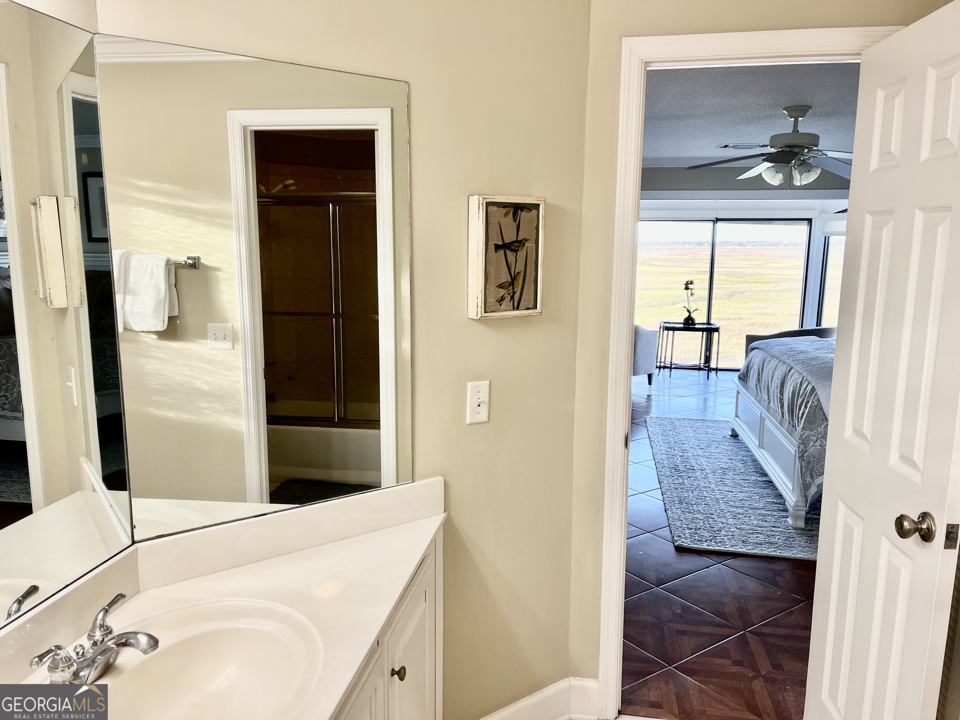 372 Moss Oak Circle St. Simons, GA 31522 - Photo 18 of 44 a en suite bathroom with a sink and a mirror
