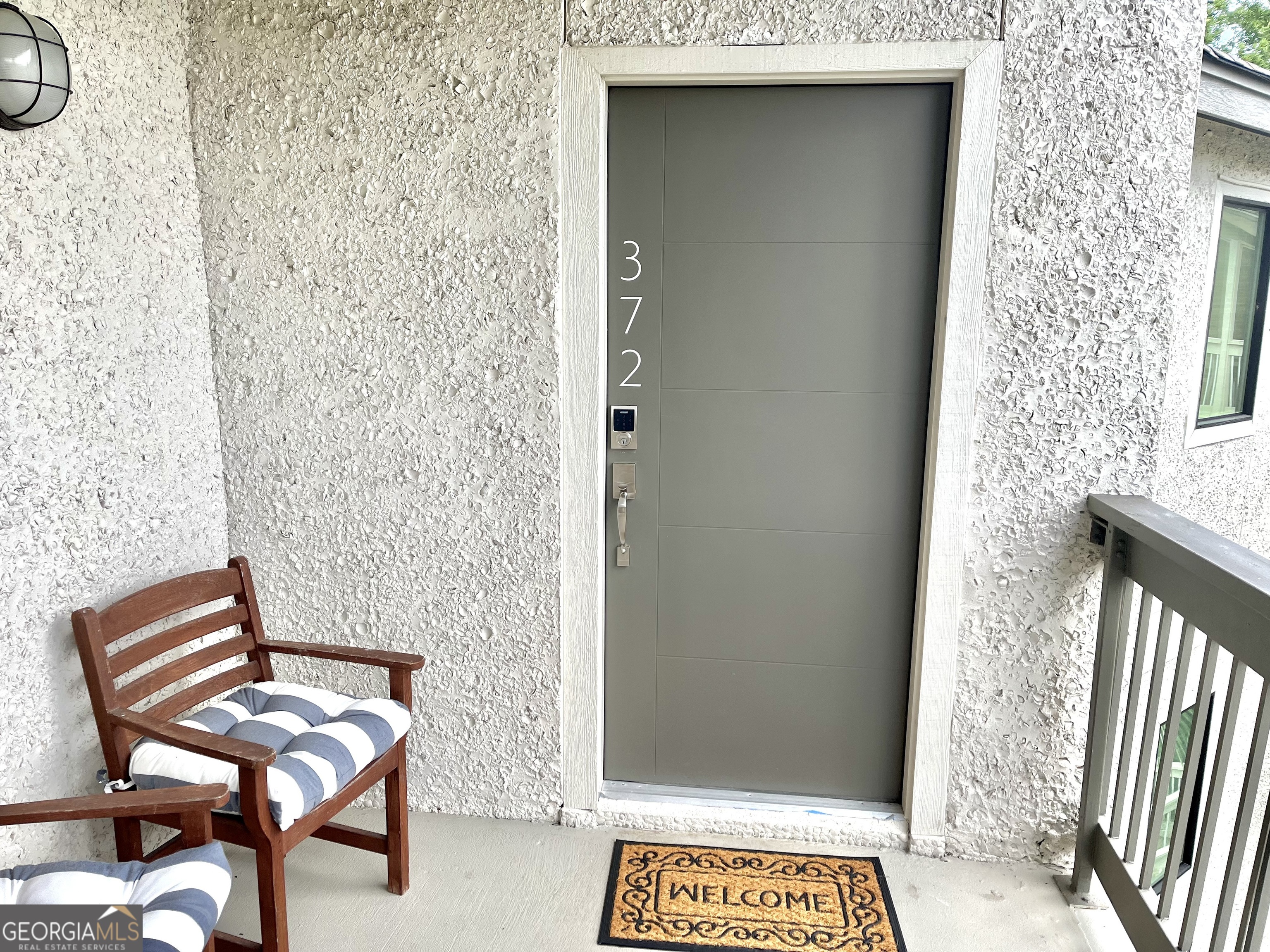 372 Moss Oak Circle St. Simons, GA 31522 - Photo 2 of 44 a view of a door and chair in front of a door
